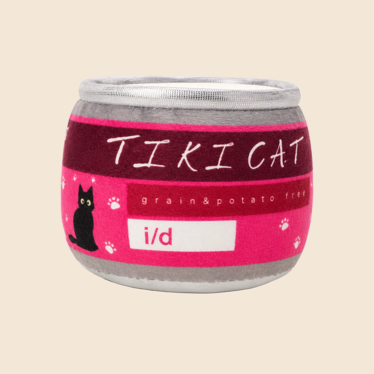 A plush toy designed to look like a canned cat food, featuring a pink and dark red label with 'TIKICAT' in white text, a black cat silhouette, and 'i/d' on a white label, set against a plain off-white background.