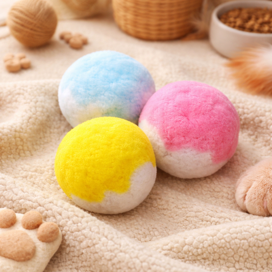 Colorful bath bombs on a textured surface with wicker baskets and wooden toys.