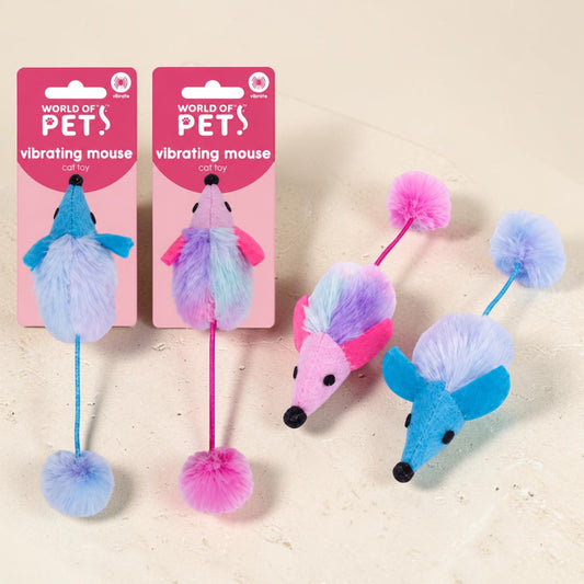 Three colorful vibrating mouse cat toys by World of Pets are displayed on a light beige textured surface, with two shown on their pink retail packaging and one each displayed loose.