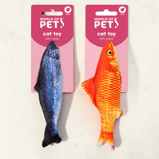 Two fish-shaped cat toys from World of Pet, one blue and one orange, each attached to its pink retail card, displayed side-by-side on a light textured background.