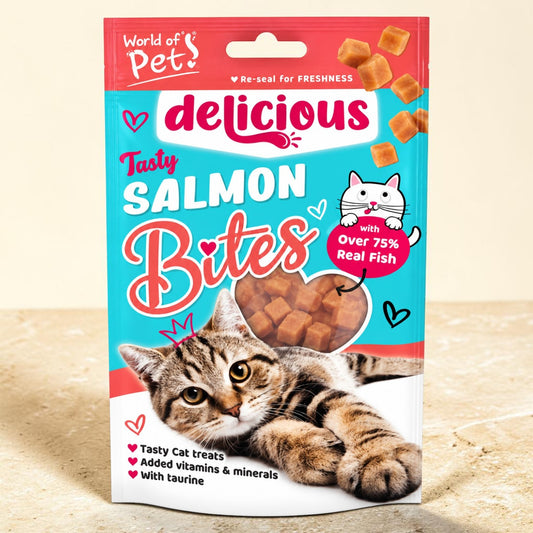 A package of 'delicious' brand Tasty Salmon Bites cat treats, featuring a tabby cat illustration on the front, set against a neutral beige background.