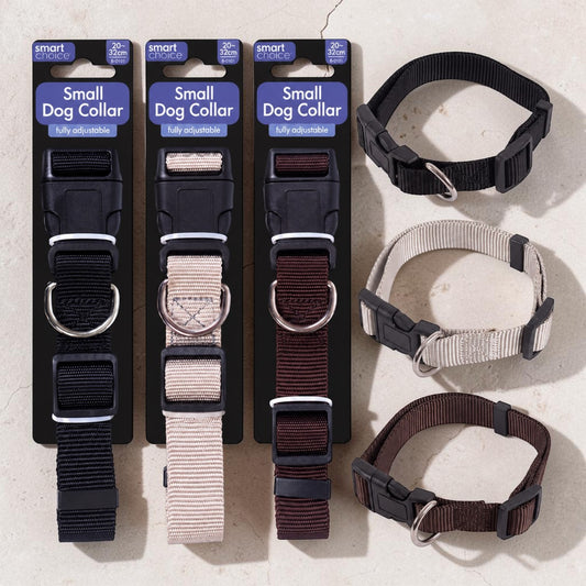 Three packaged dog collars and three loose dog collars displayed on a light stone surface. The packages are labeled 'Small Dog Collar' and show black, beige, and dark brown nylon collars with metal D-rings and quick-release buckles.