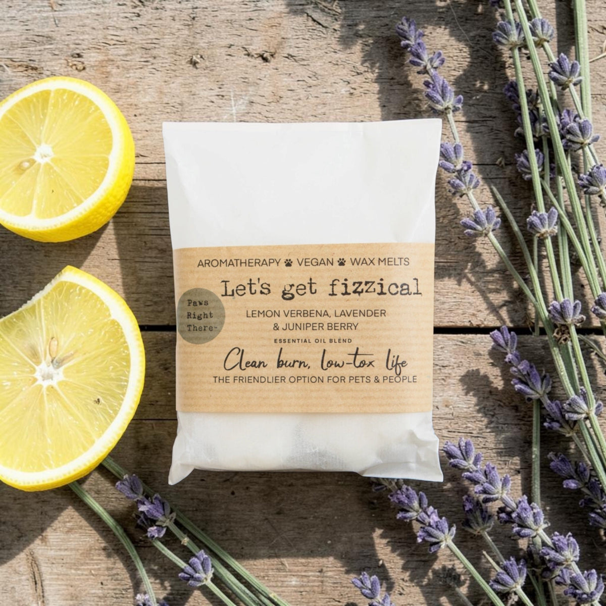 Packaged product with lavender and lemons on a wooden surface