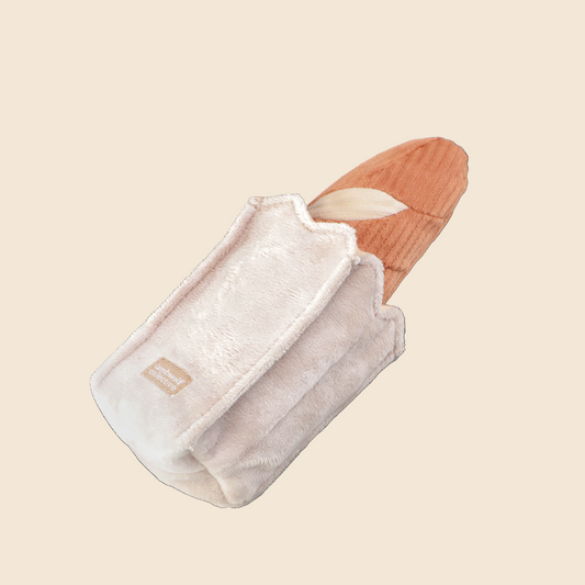 Mini Baguette Enrichment Dog Toy featuring a soft squeaky baguette and crinkly treat-hiding bag.