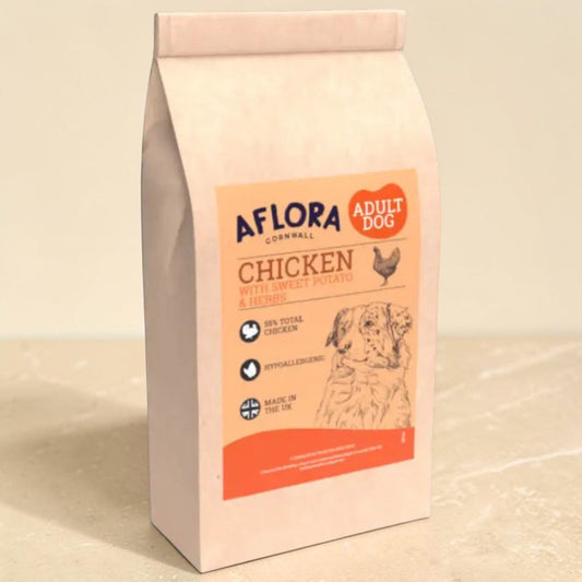A bag of Aflora Cornwall Adult Dog food, specifically Chicken with Liver, Potato & Herbs, shown on a neutral beige background.