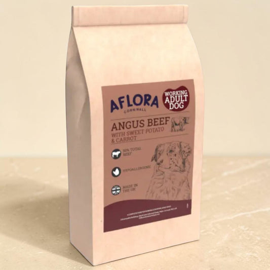 A bag of Aflora Cornwall Working Adult Dog food, specifically Angus Beef with Sweet Potato & Carrot, in a light beige stand-up pouch with a brown label.