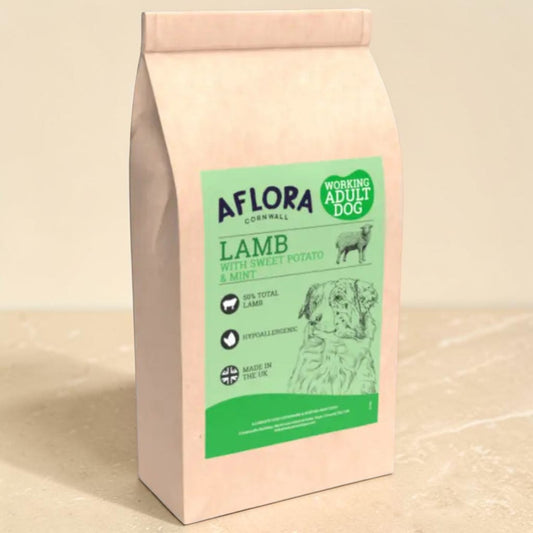 A bag of Aflora Cornwall Lamb dog food with Sweet Potato & Mint, standing on a light beige surface against a matching background.
